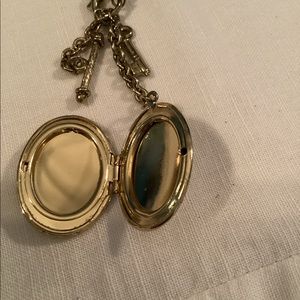 Vintage 1928 gold toned locket on long chain